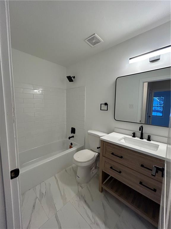 1270 Morrow Road Morrow, GA 30260 - Photo 7 of 12 a bathroom with a double vanity sink toilet mirror and shower