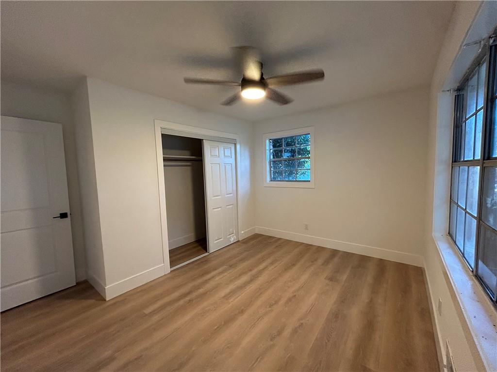 1270 Morrow Road Morrow, GA 30260 - Photo 10 of 12 wooden floor in an empty room with a window