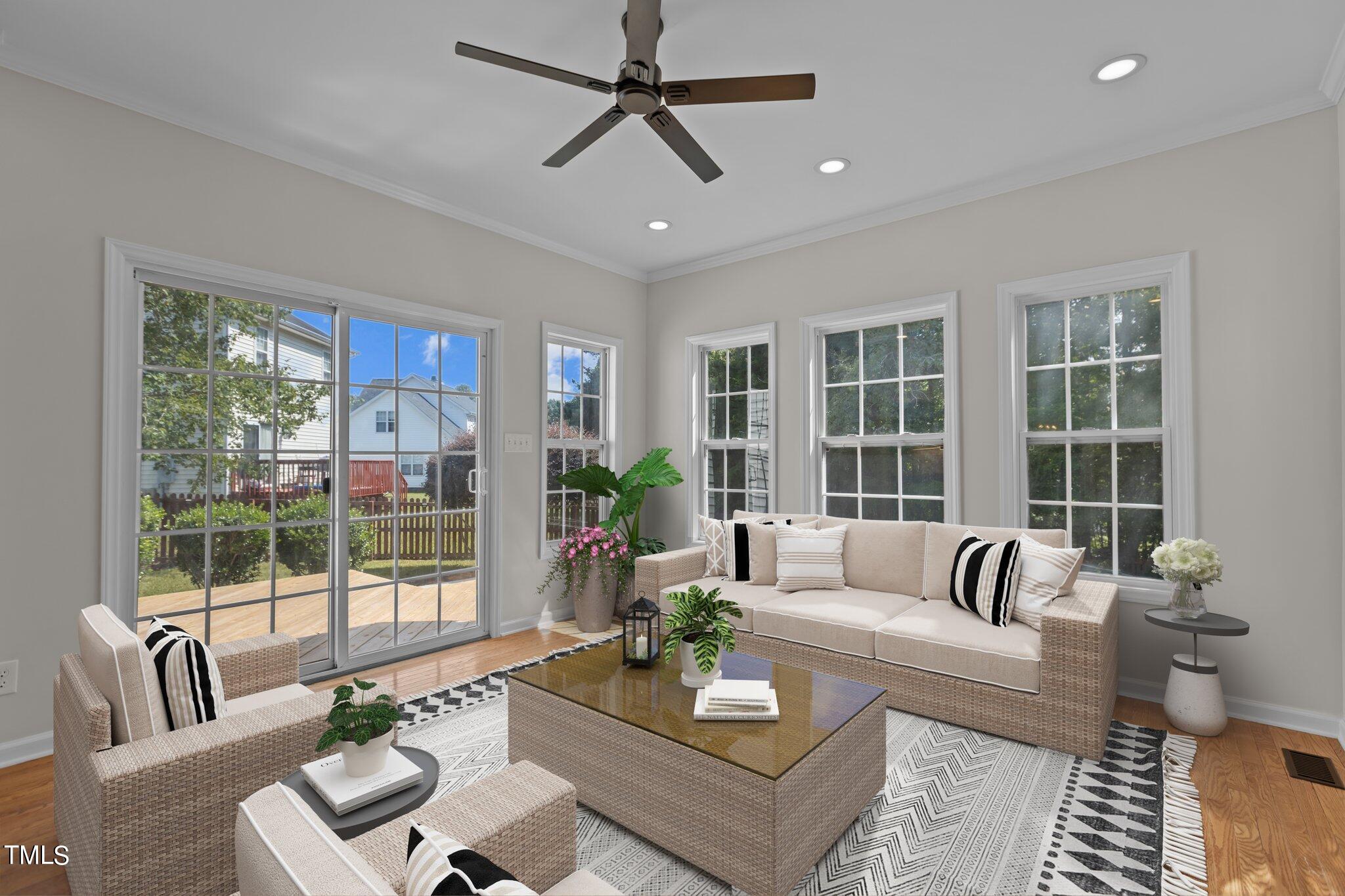 3225 Forest Mill Circle Raleigh, NC 27616 - Photo 11 of 36 a living room with furniture and a large window