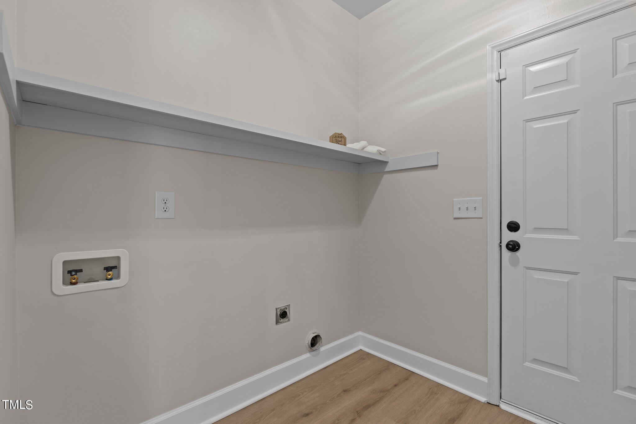 3225 Forest Mill Circle Raleigh, NC 27616 - Photo 16 of 36 a view of a room with wooden floor