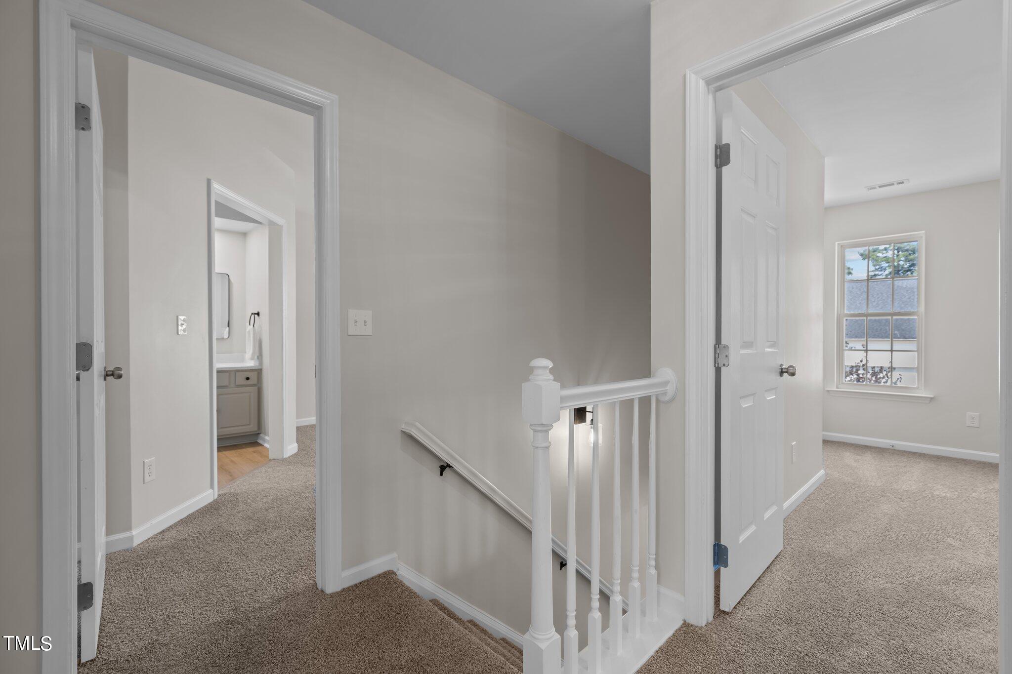 3225 Forest Mill Circle Raleigh, NC 27616 - Photo 17 of 36 a view of a hallway with windows