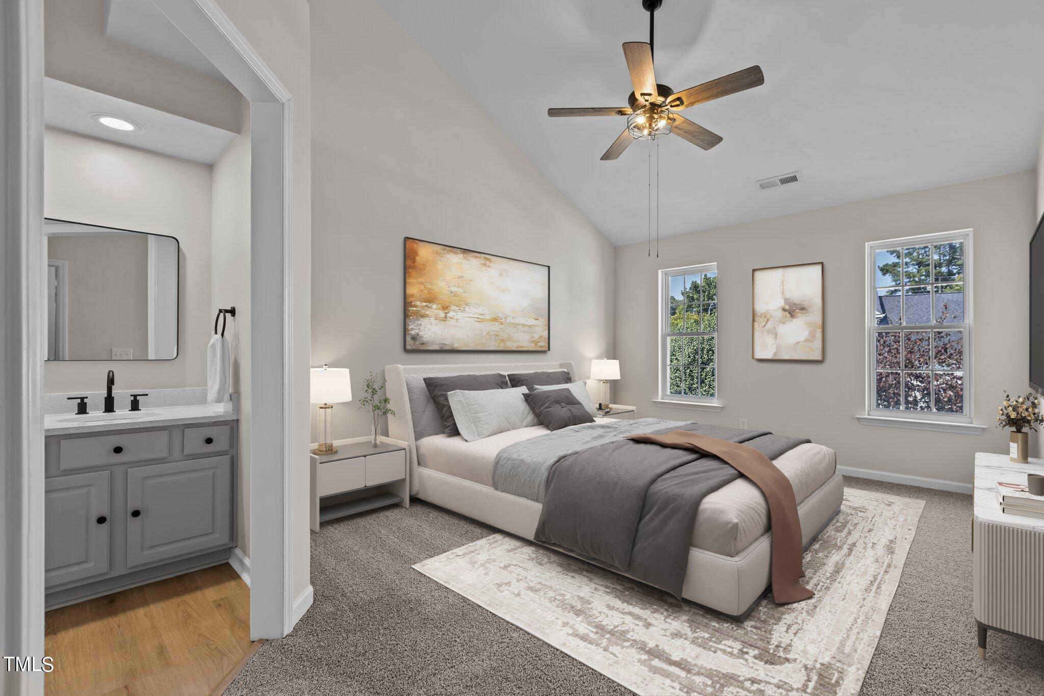 3225 Forest Mill Circle Raleigh, NC 27616 - Photo 18 of 36 a bedroom with a bed and a chandelier