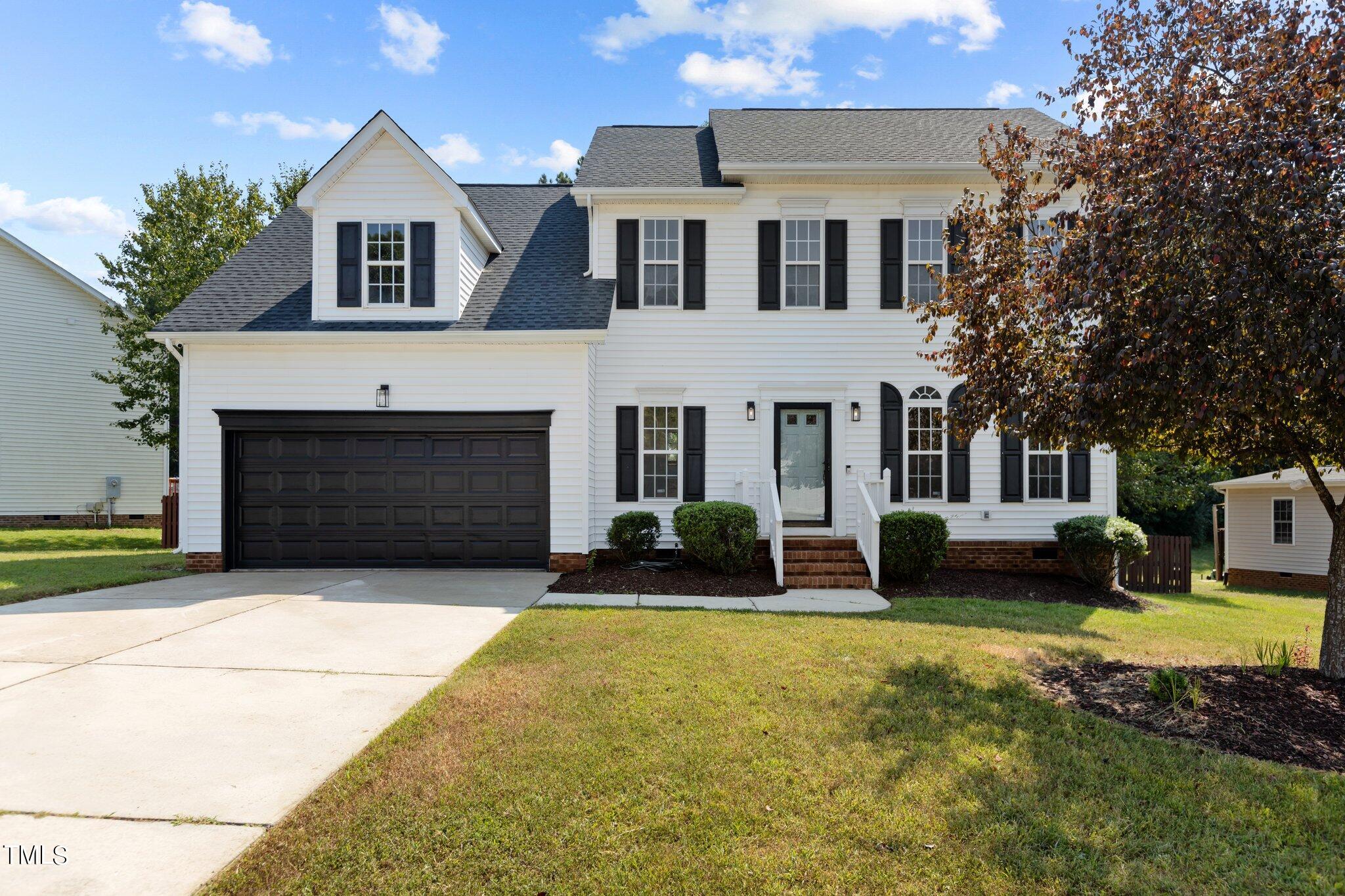 3225 Forest Mill Circle Raleigh, NC 27616 - Photo 2 of 36 a front view of a house with yard and parking