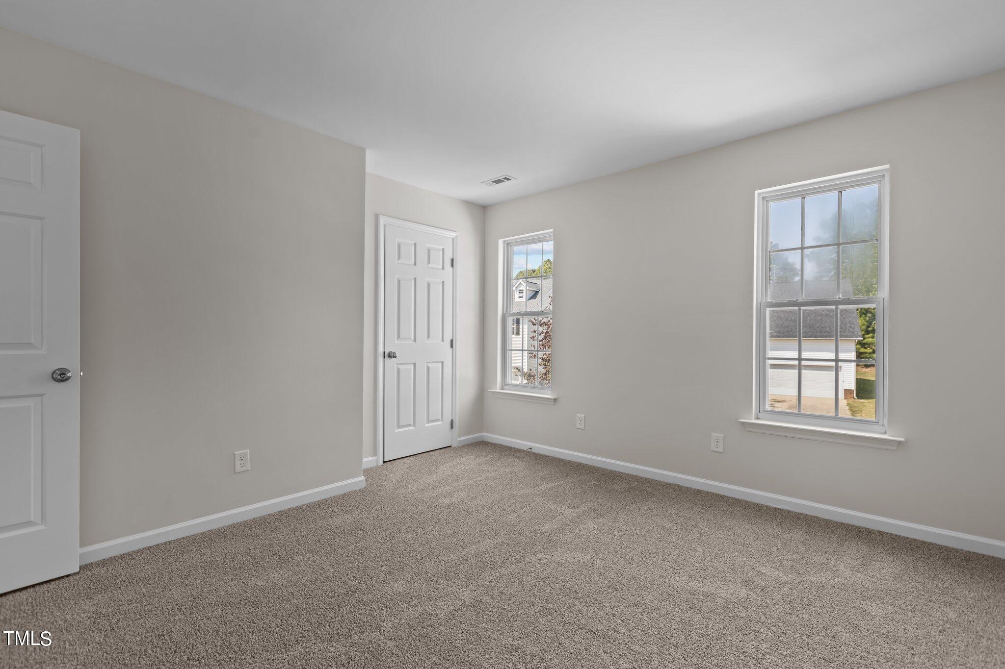 3225 Forest Mill Circle Raleigh, NC 27616 - Photo 24 of 36 an empty room with windows