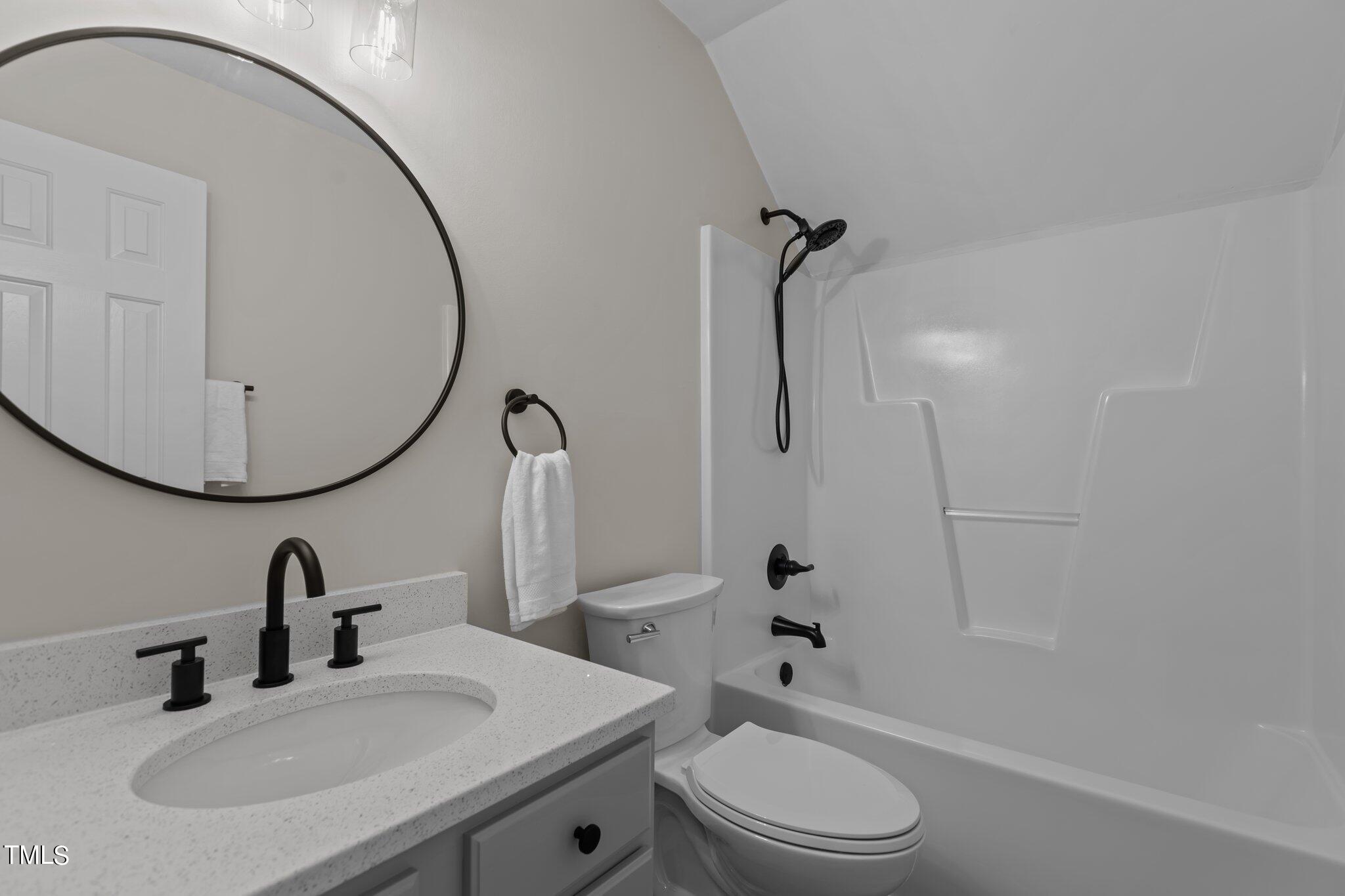 3225 Forest Mill Circle Raleigh, NC 27616 - Photo 25 of 36 a bathroom with a sink a toilet and a mirror
