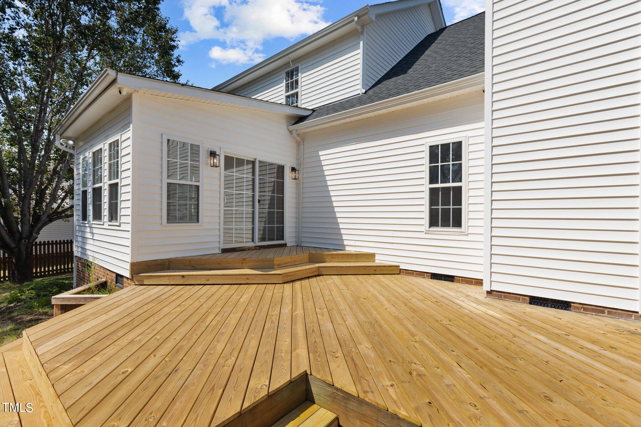 3225 Forest Mill Circle Raleigh, NC 27616 - Photo 31 of 36 a view of a house with a wooden deck