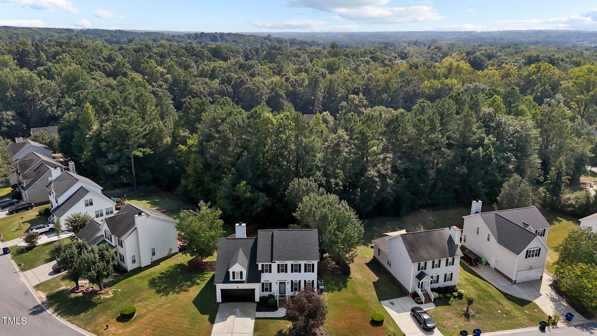 3225 Forest Mill Circle Raleigh, NC 27616 - Photo 33 of 36 an aerial view of a house with a garden