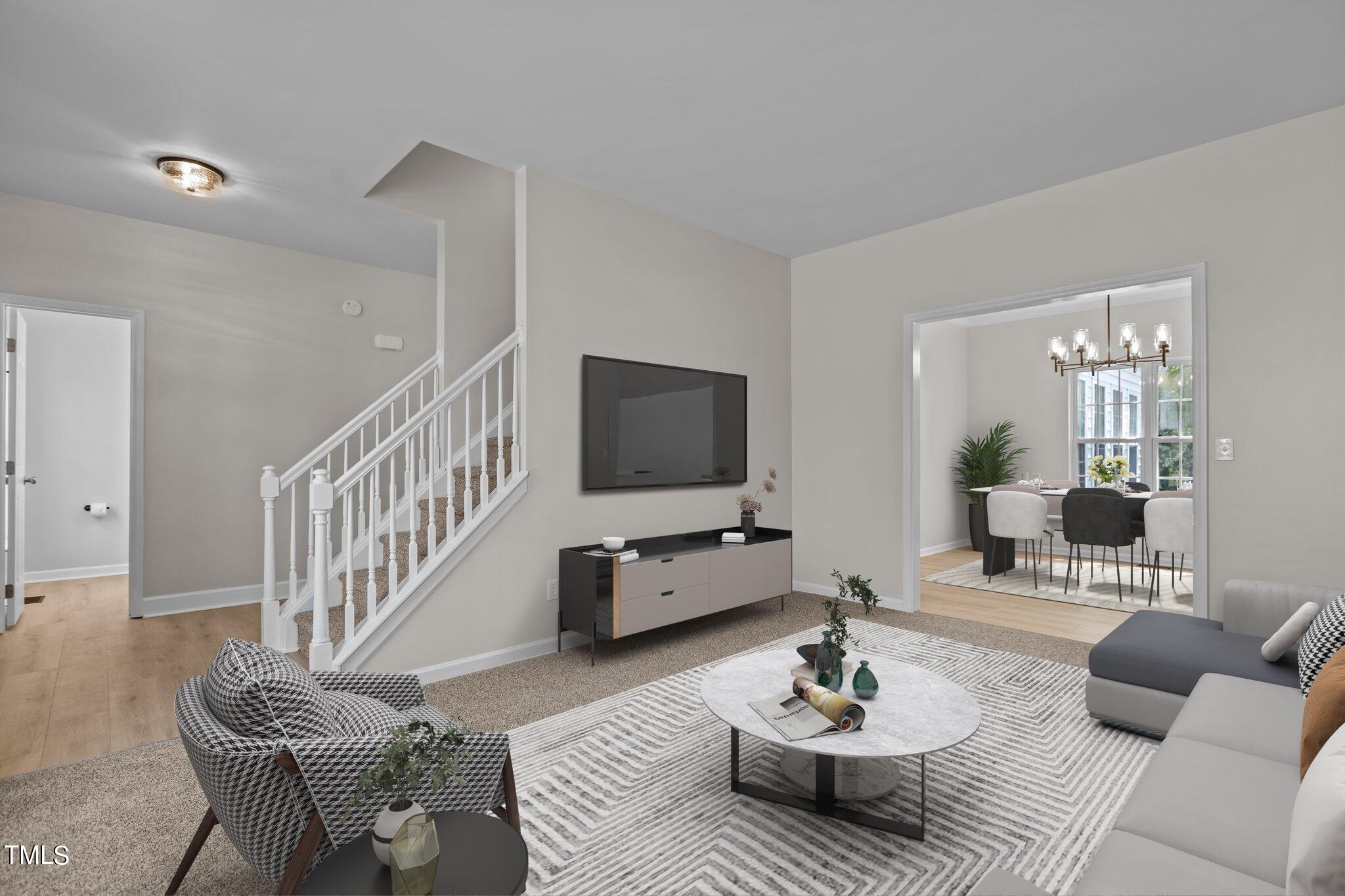 3225 Forest Mill Circle Raleigh, NC 27616 - Photo 4 of 36 a living room with furniture and a flat screen tv