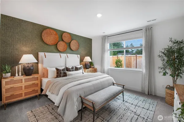 a bedroom with a bed and window