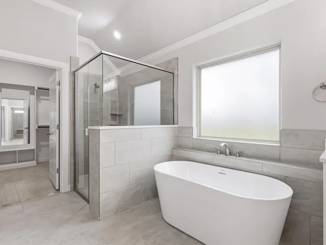 a bathroom with a bathtub and a sink