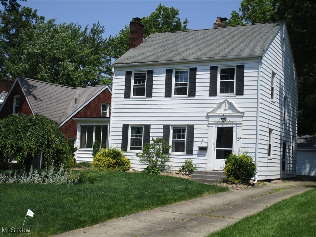 134 Ridgewood Drive Youngstown, OH 44512 - Photo 28 of 29 Colonial-style house with a chimney and a front lawn