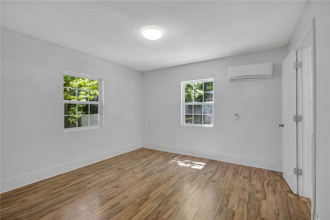 1616 Meadow Brook Circle Anderson, SC 29624 - Photo 14 of 24 This airy room features durable wood flooring and ample natural light from multiple windows.