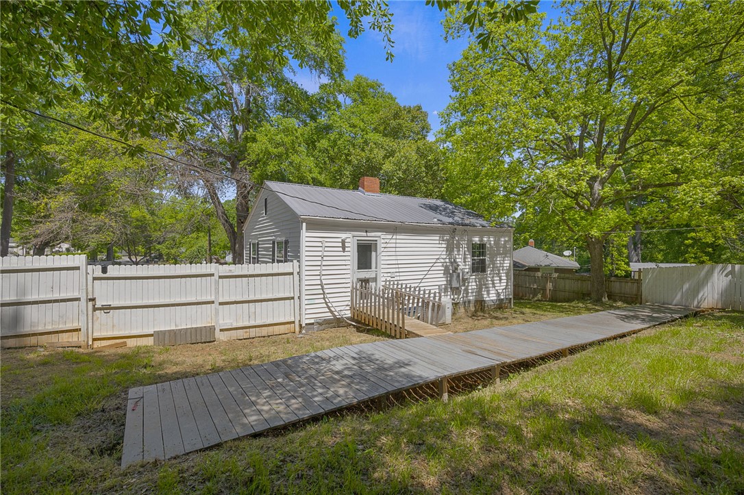 1616 Meadow Brook Circle Anderson, SC 29624 - Photo 19 of 24 A quaint residence features a charming fenced yard, offering private outdoor living.