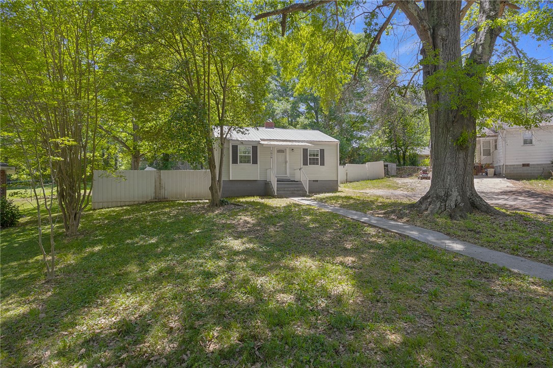 1616 Meadow Brook Circle Anderson, SC 29624 - Photo 2 of 24 This charming home offers a welcoming facade with a well-maintained lawn and mature trees.