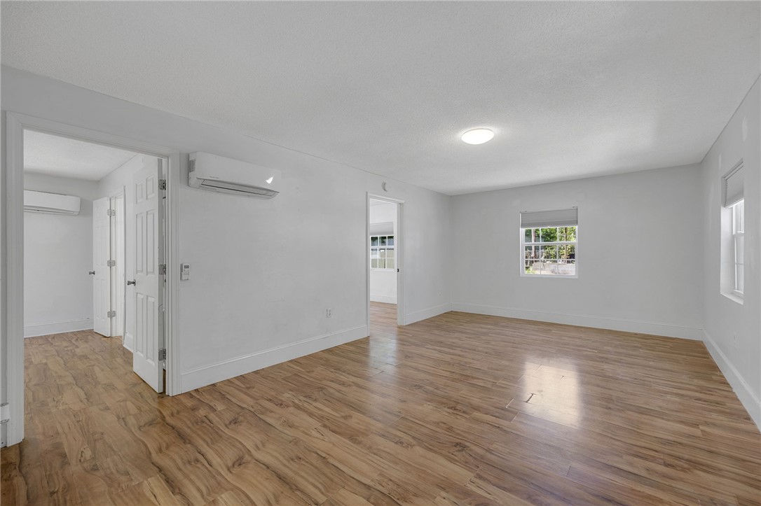 1616 Meadow Brook Circle Anderson, SC 29624 - Photo 4 of 24 This bright, spacious room features warm wood flooring and ample natural light, creating an inviting atmosphere.