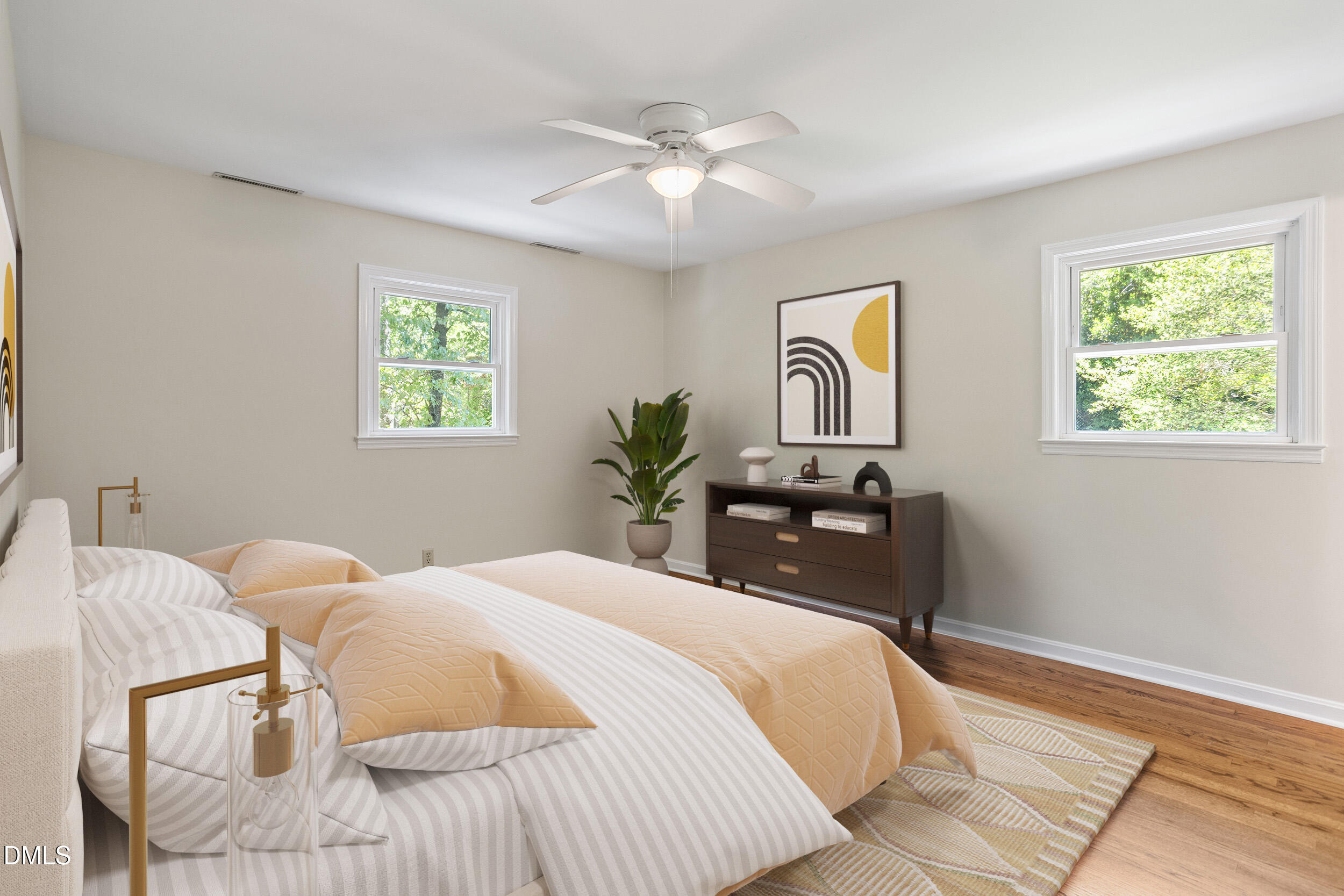 4711 Tanglewood Drive Raleigh, NC 27612 - Photo 6 of 39 a bedroom with a large bed and a chandelier