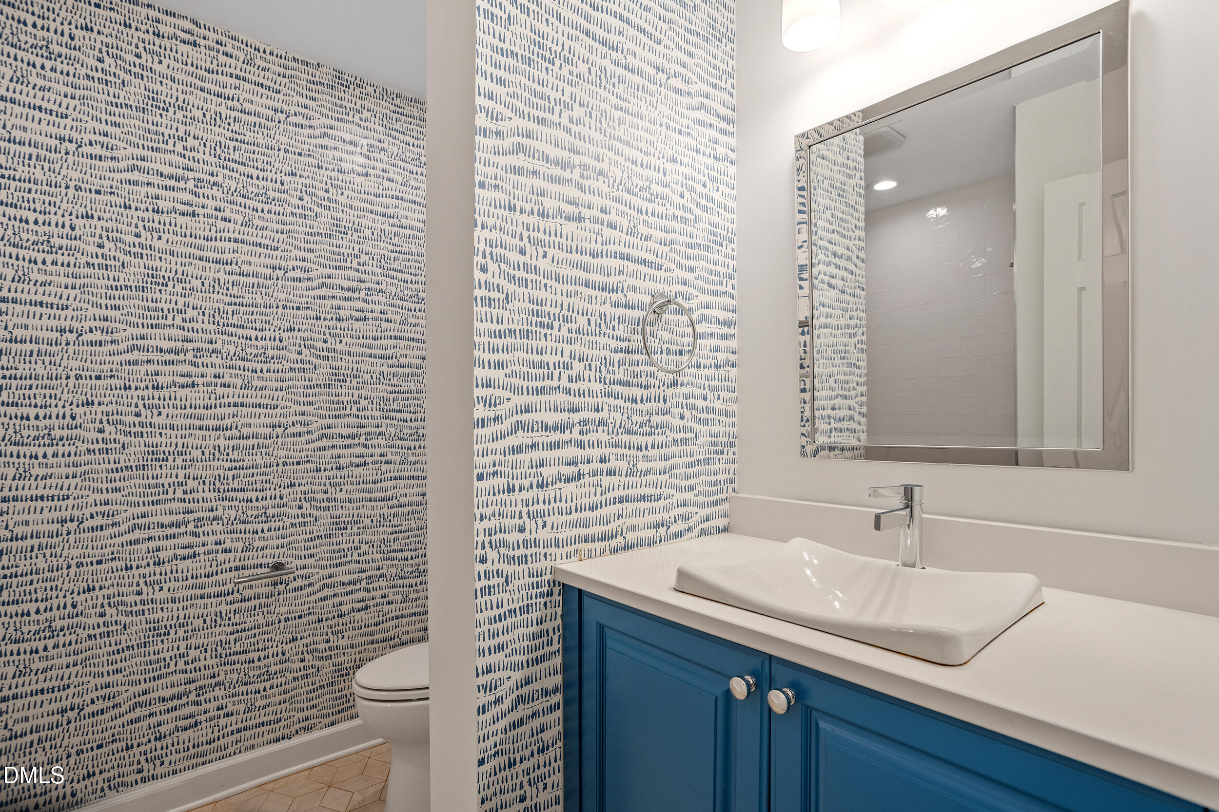 4711 Tanglewood Drive Raleigh, NC 27612 - Photo 7 of 39 a bathroom with a sink a toilet and mirror