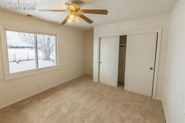 a view of an empty room with a window