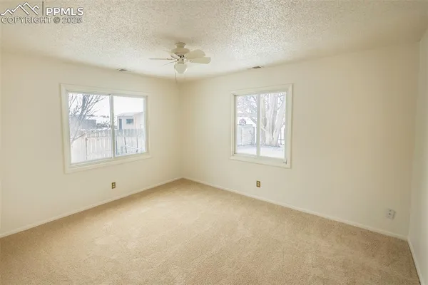 a view of an empty room with a window