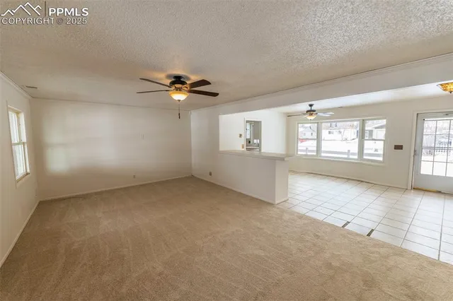 a view of a big room with windows and cabinet