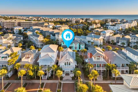 an aerial view of residential houses with outdoor space
