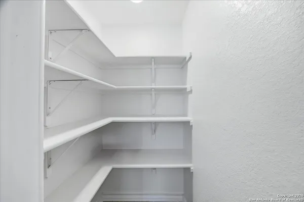 a view of an empty walk in closet