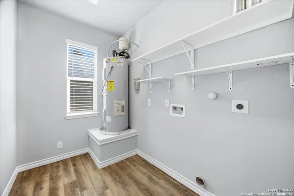 a bathroom with a tub and a window