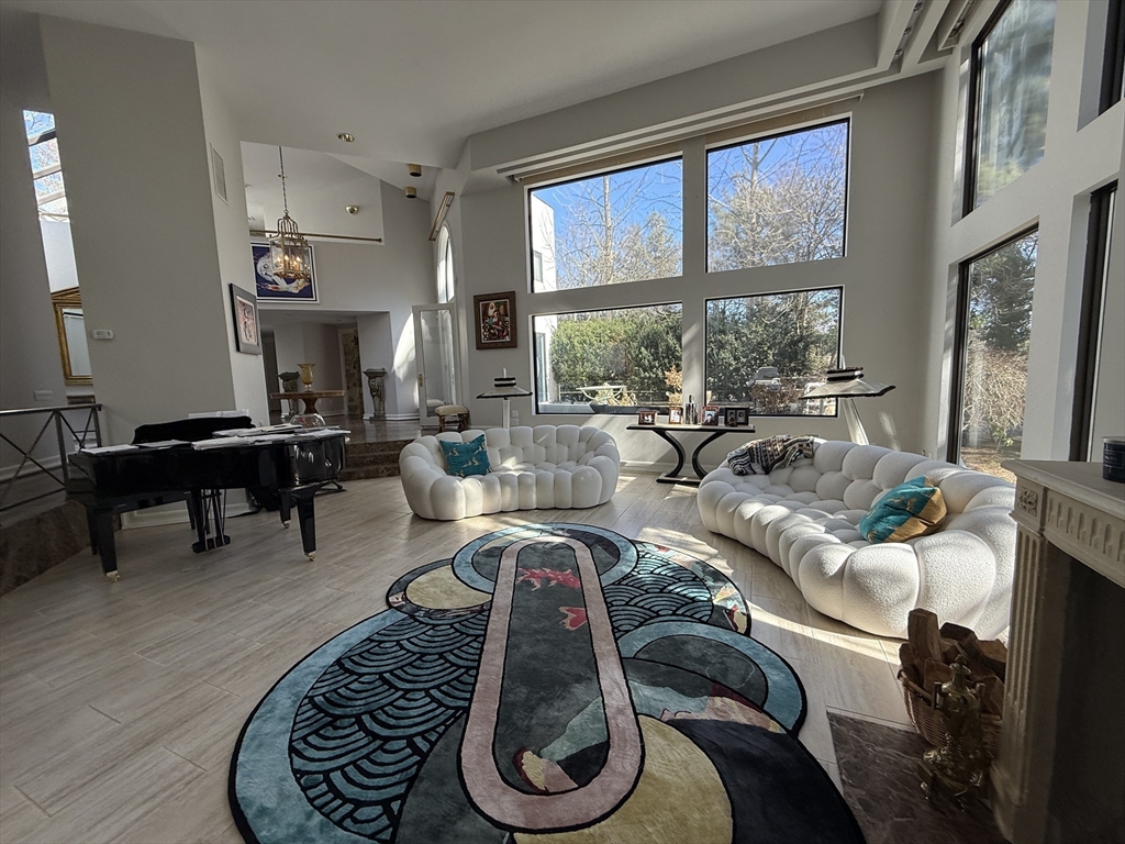 132 Yarmouth Road Brookline, MA 02467 - Photo 3 of 22 a living room with furniture and a large window