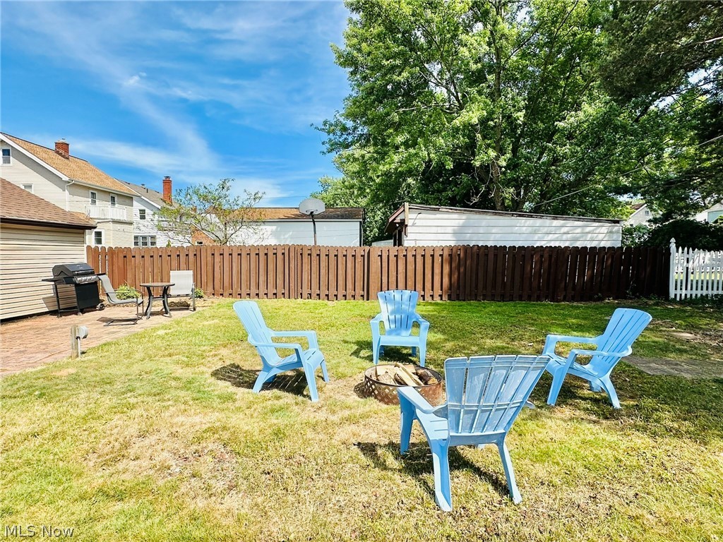 7607 Ridgefield Avenue Cleveland, OH 44129 - Photo 27 of 28 View of yard with a fire pit
