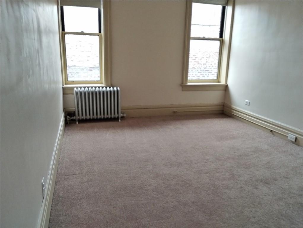 41 Morgantown Street, Unit 7 Uniontown, PA 15401 - Photo 7 of 10 an empty room with windows