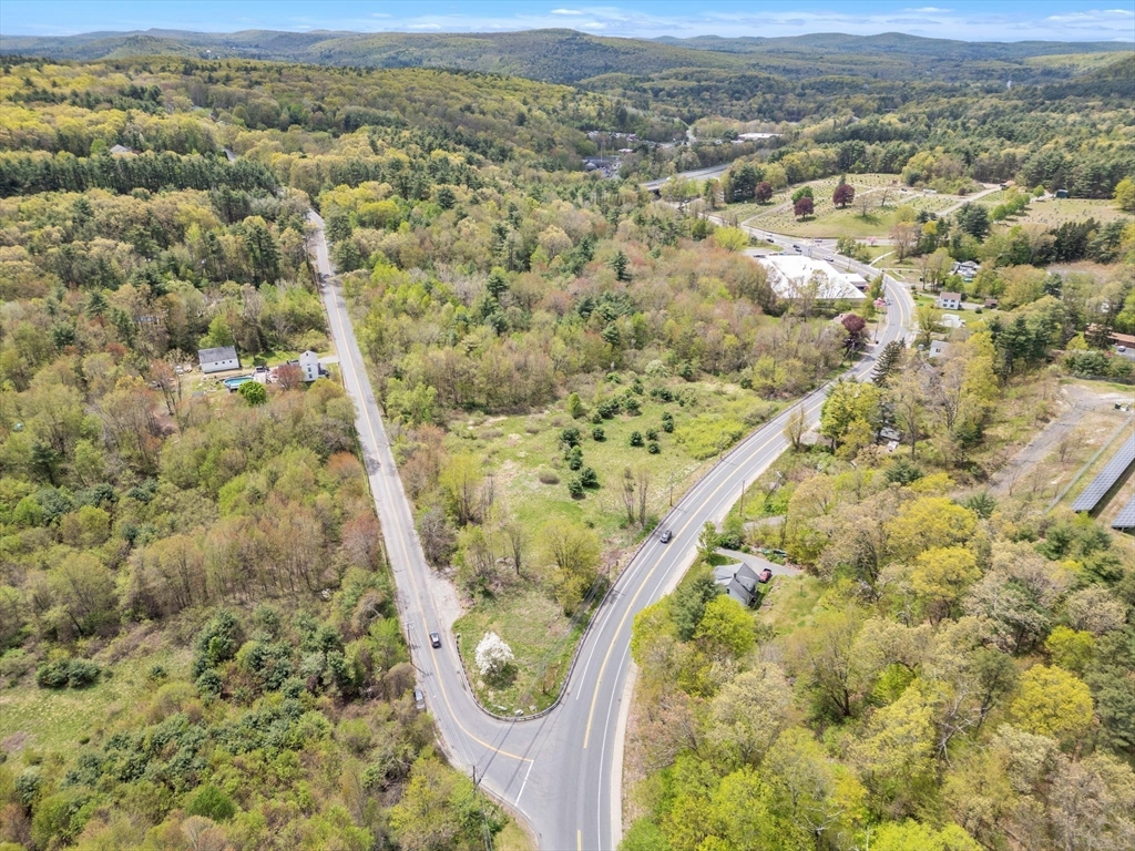 101 Ware Street Palmer, MA 01069 - Photo 17 of 26 an aerial view of a yard with mountain