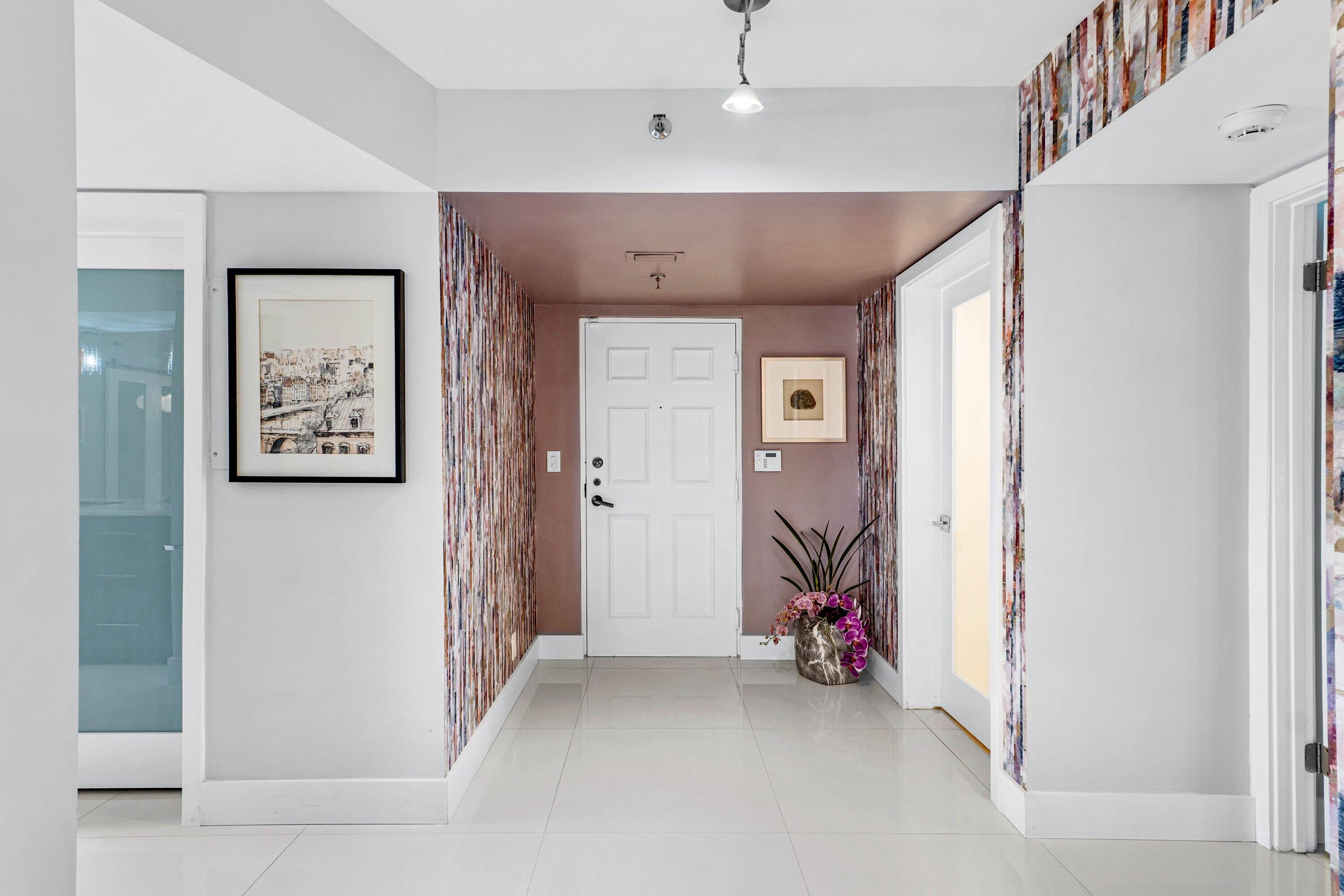 7572 Regency Lake Drive, Unit 301 Boca Raton, FL 33433 - Photo 2 of 38 a view of a room with gym equipment
