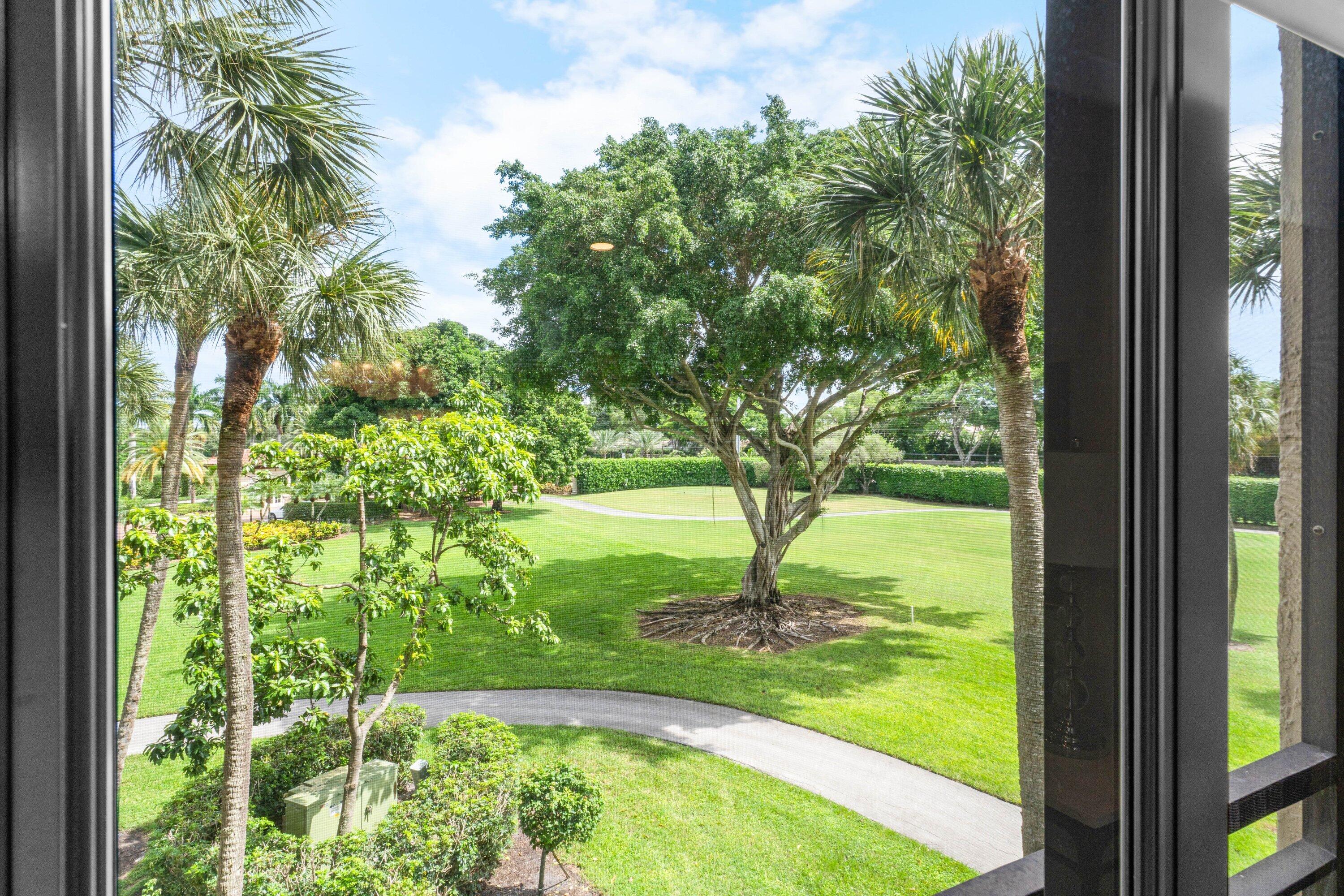 7572 Regency Lake Drive, Unit 301 Boca Raton, FL 33433 - Photo 27 of 38 a view of yard from a window