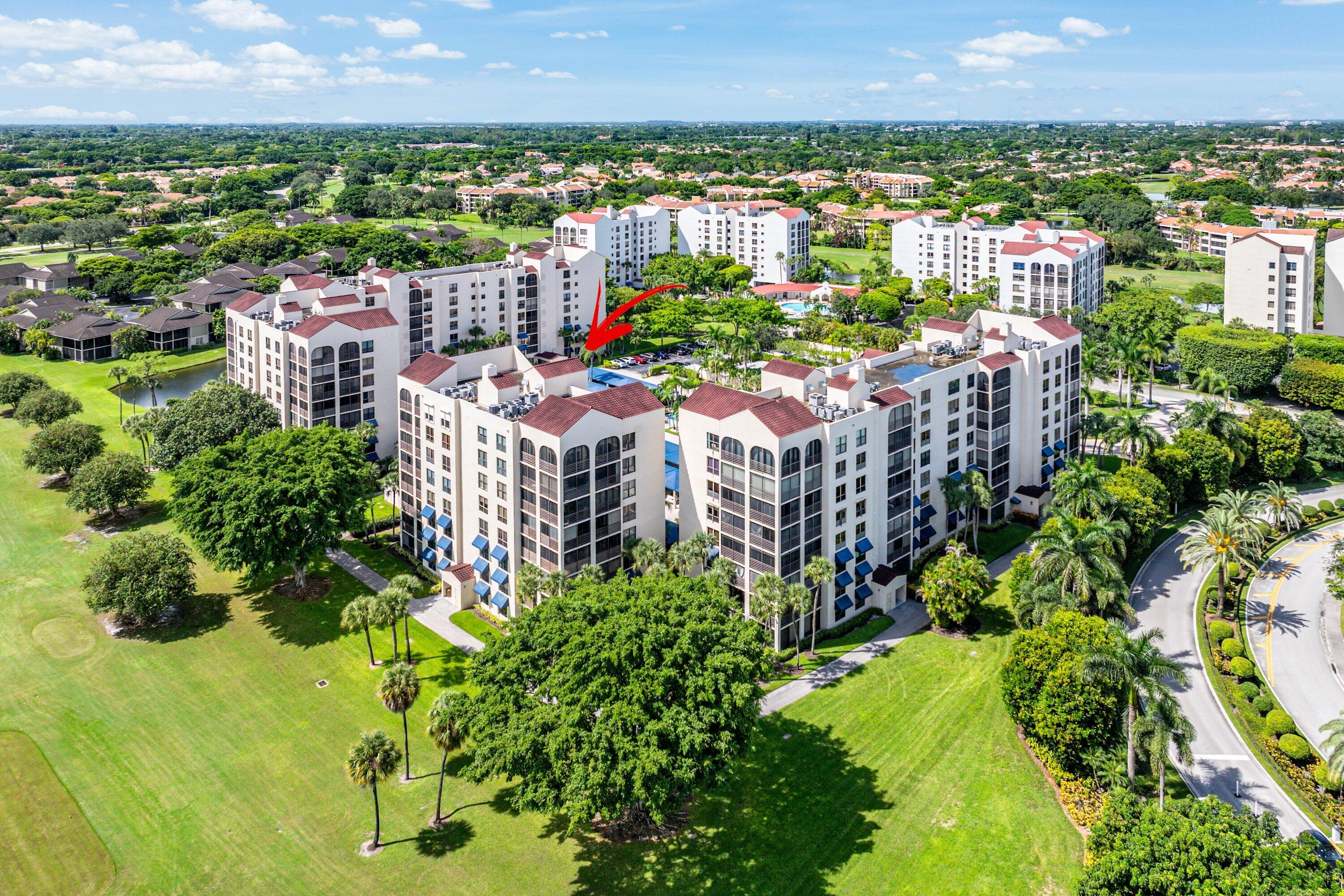 7572 Regency Lake Drive, Unit 301 Boca Raton, FL 33433 - Photo 31 of 38 a city view with tall buildings