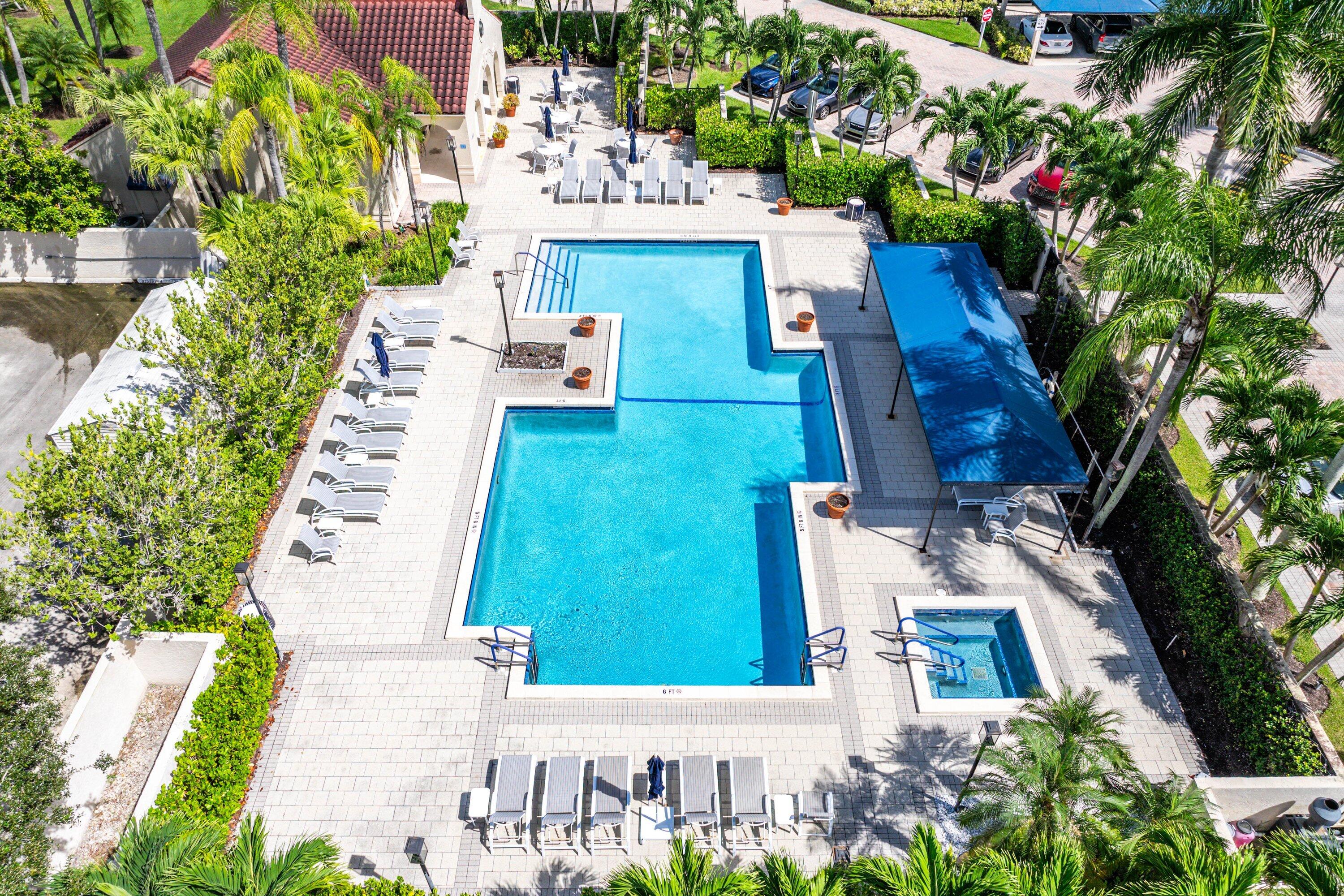 7572 Regency Lake Drive, Unit 301 Boca Raton, FL 33433 - Photo 34 of 38 a view of building with yard