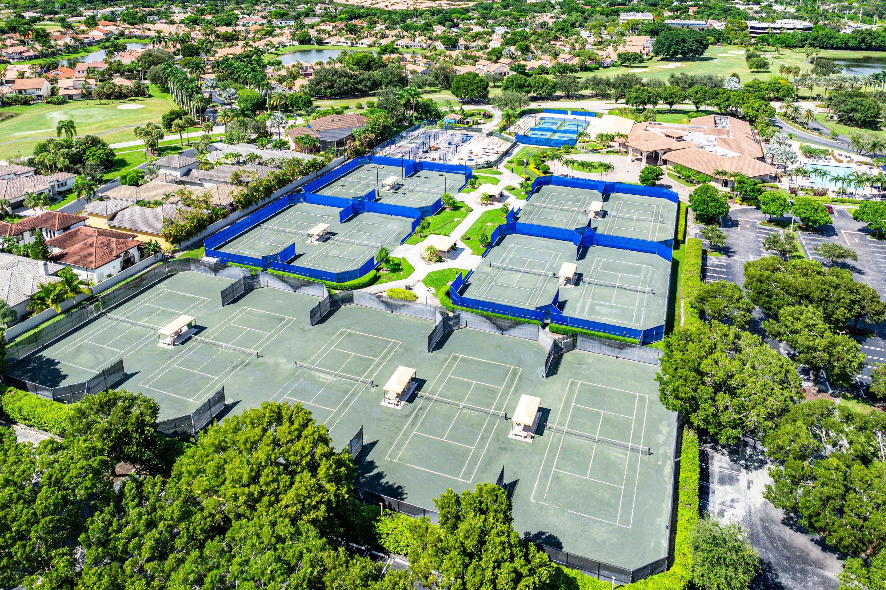 7572 Regency Lake Drive, Unit 301 Boca Raton, FL 33433 - Photo 36 of 38 an aerial view of residential houses with outdoor space