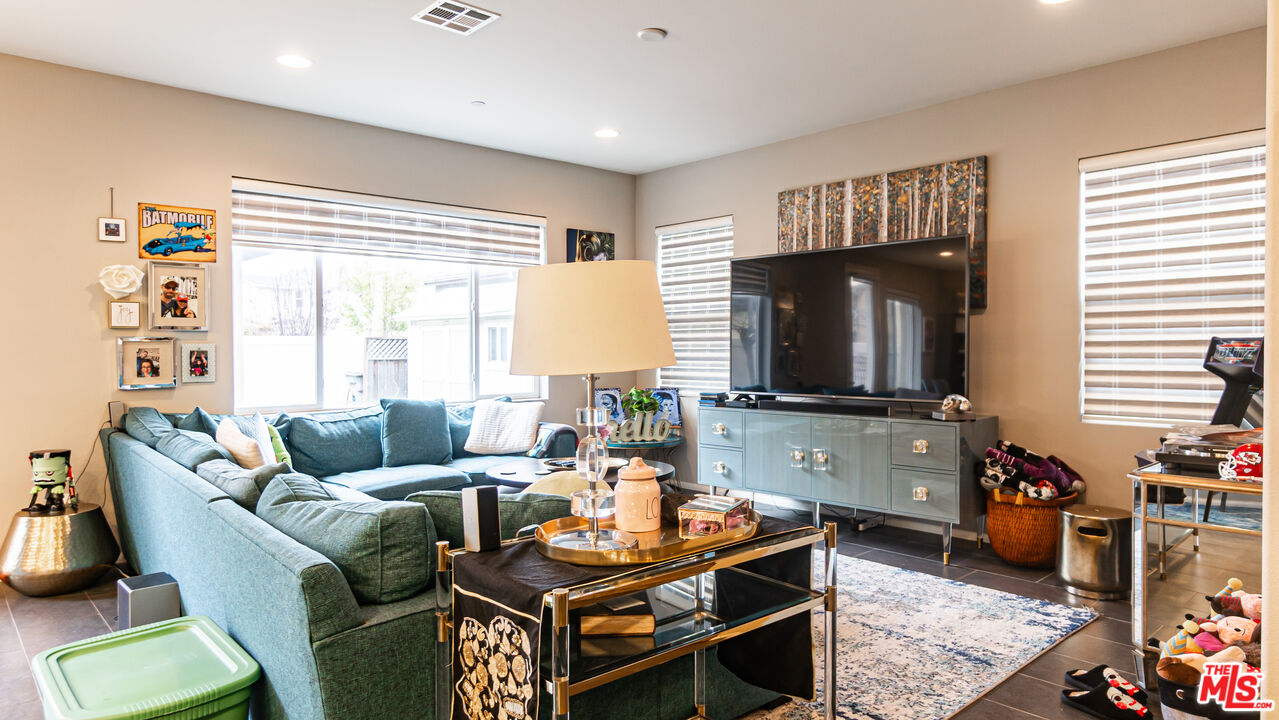 3564 Albion Drive Oxnard, CA 93036 - Photo 16 of 41 a living room with furniture and a flat screen tv