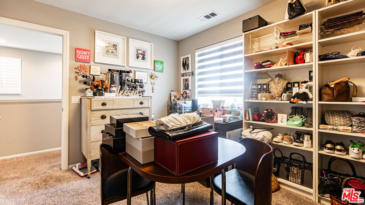 3564 Albion Drive Oxnard, CA 93036 - Photo 20 of 41 a view of a dining room with furniture and a book shelf
