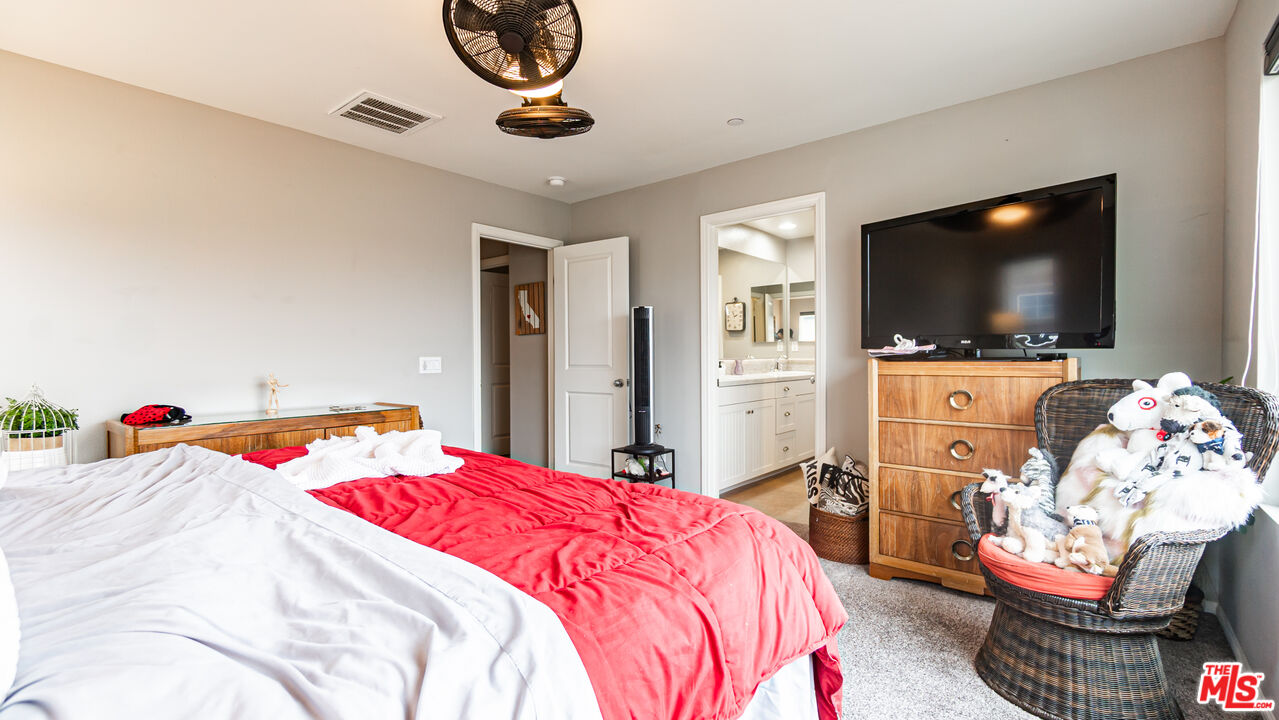 3564 Albion Drive Oxnard, CA 93036 - Photo 25 of 41 a bedroom with a bed and a flat screen tv