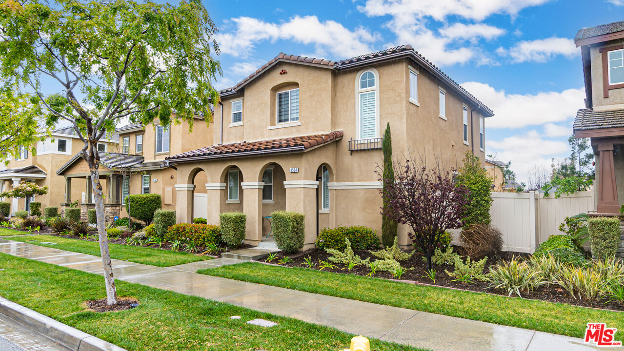 3564 Albion Drive Oxnard, CA 93036 - Photo 3 of 41 a view of a white house with a big yard and potted plants