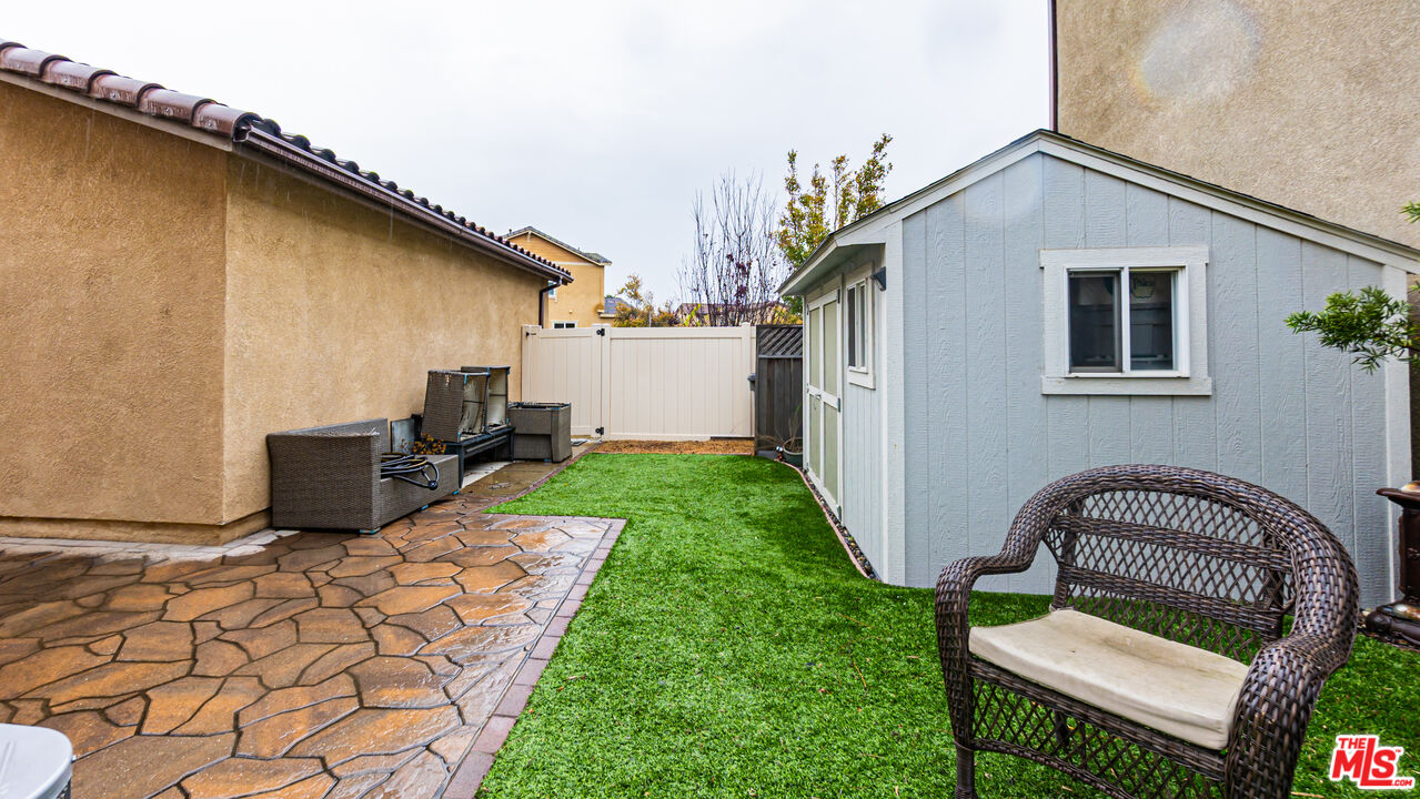 3564 Albion Drive Oxnard, CA 93036 - Photo 34 of 41 a view of a chair and tables in the back yard of the house