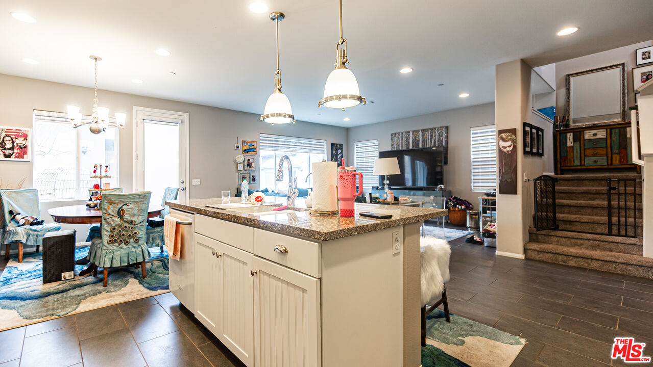3564 Albion Drive Oxnard, CA 93036 - Photo 6 of 41 a kitchen with stainless steel appliances granite countertop a sink stove and wooden floor