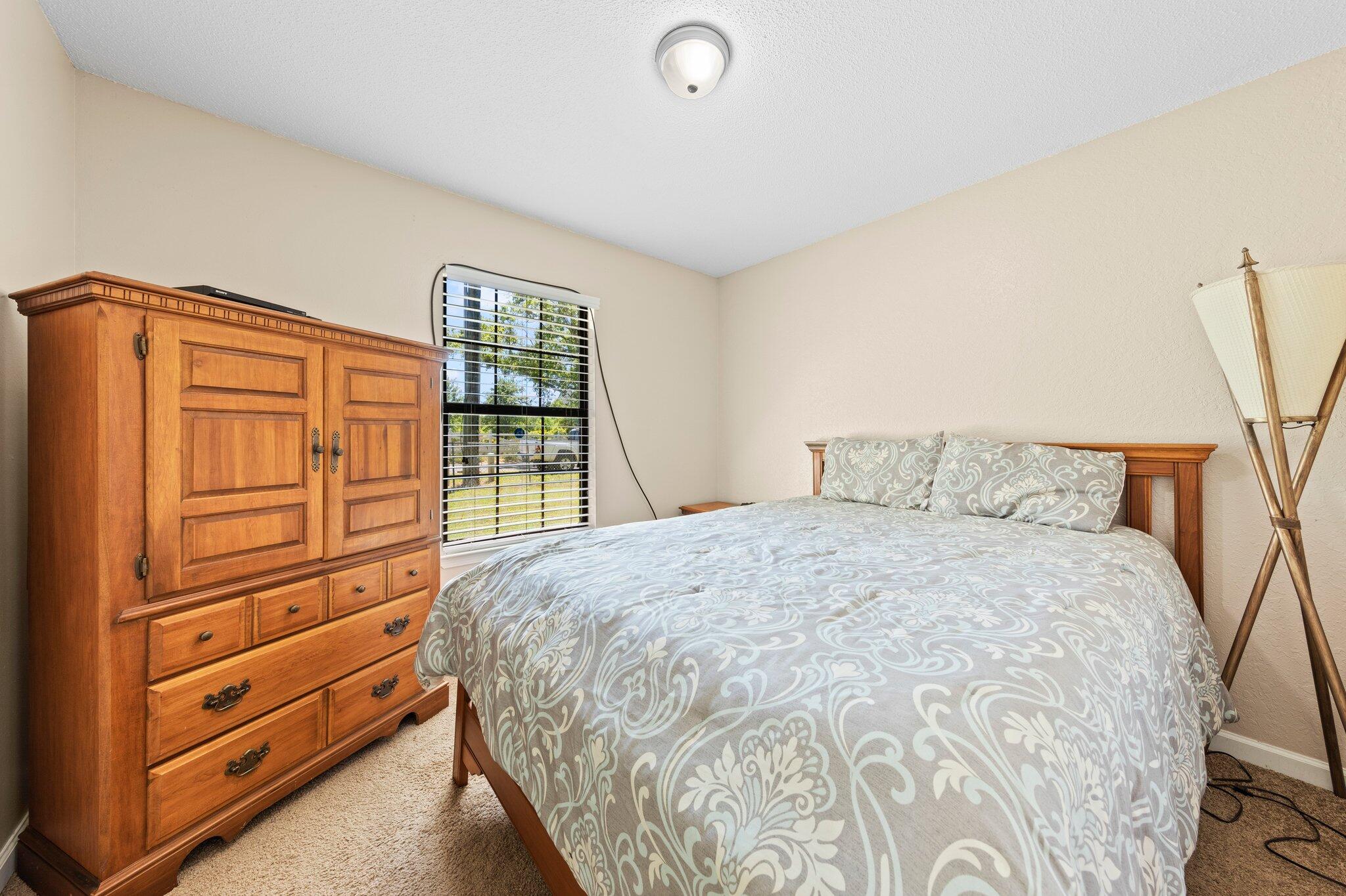 6066 Old Bethel Road Crestview, FL 32536 - Photo 16 of 25 a bedroom with a bed and a window