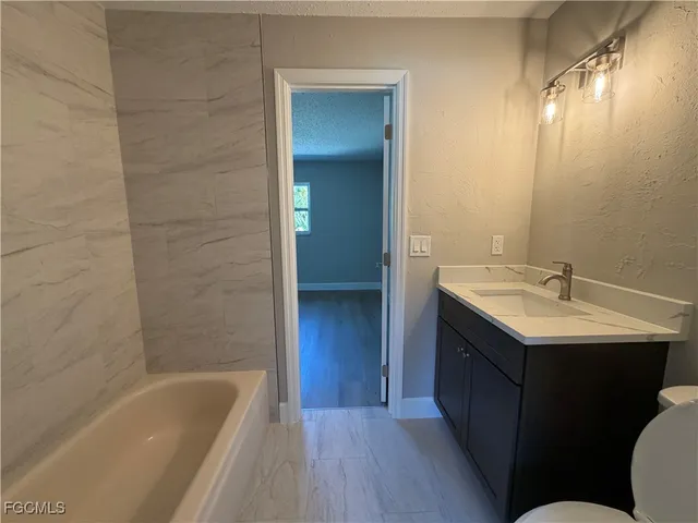 a bathroom with a sink and a bathtub