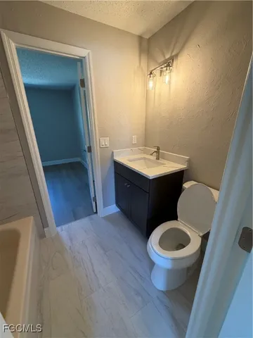 a bathroom with a sink and a toilet