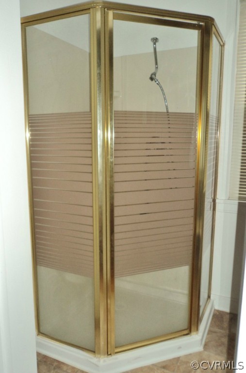 3030 Sherbourne Road Richmond, VA 23237 - Photo 11 of 20 a bathroom with a glass shower door and mirror