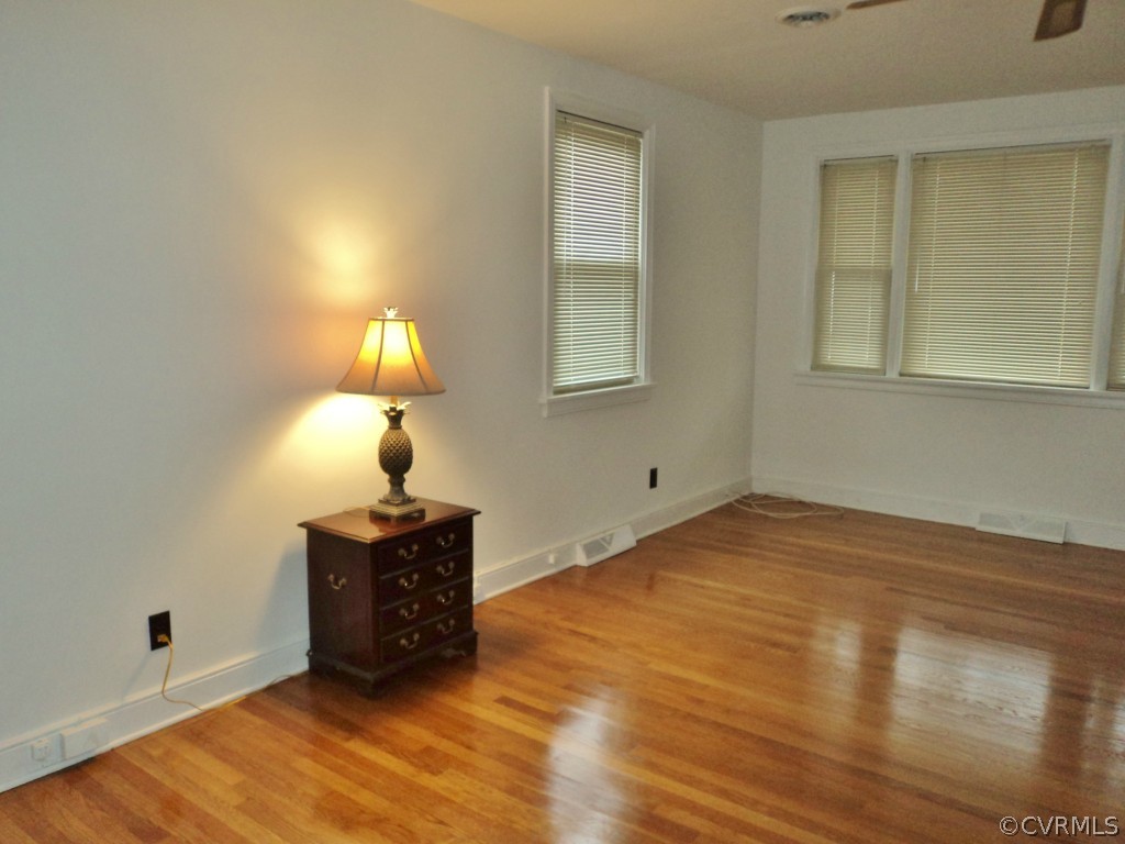 3030 Sherbourne Road Richmond, VA 23237 - Photo 5 of 20 a view of an empty room with wooden floor and a window