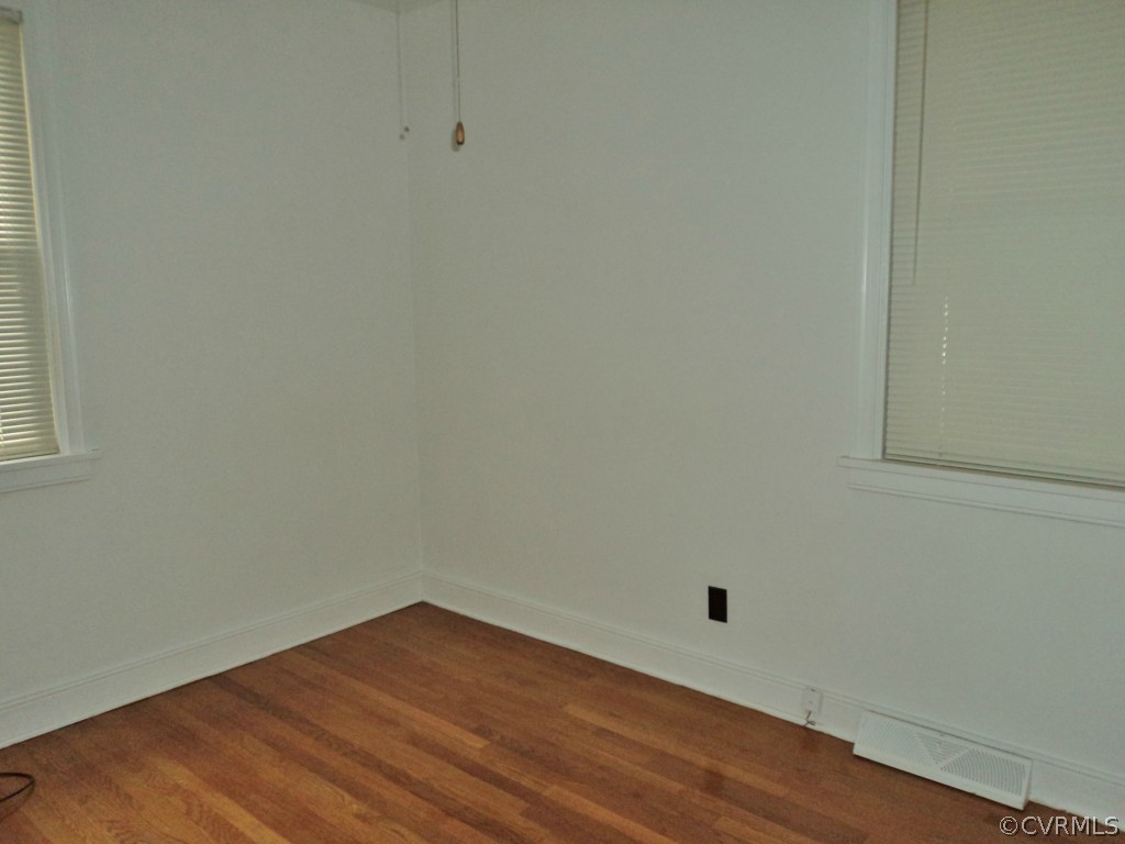 3030 Sherbourne Road Richmond, VA 23237 - Photo 8 of 20 a view of an empty room with wooden floor