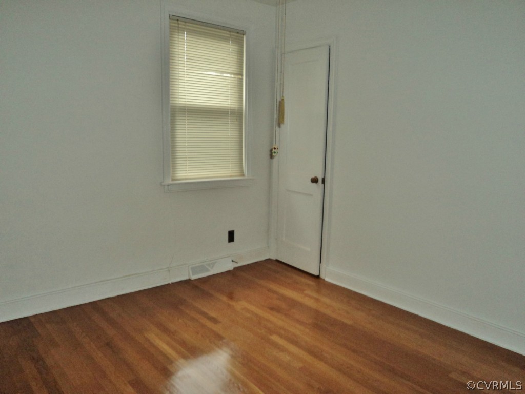 3030 Sherbourne Road Richmond, VA 23237 - Photo 10 of 20 an empty room with wooden floor and windows