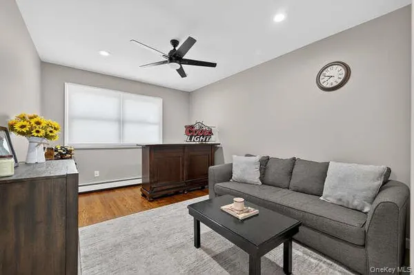 a living room with furniture and a window